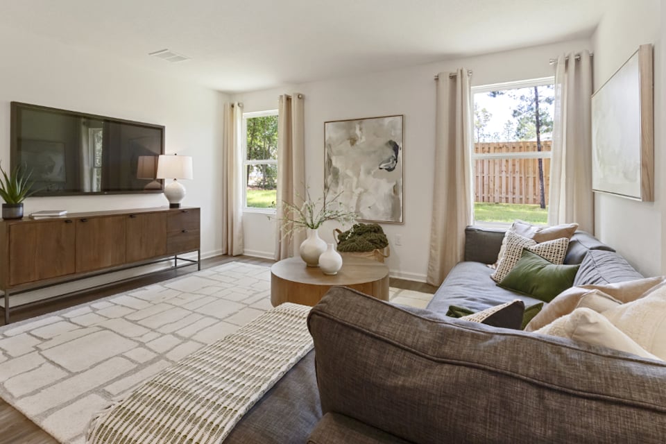 A living room with a couch and a table.