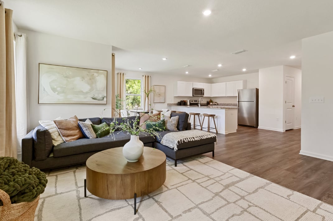 A living room with a couch and a coffee table.