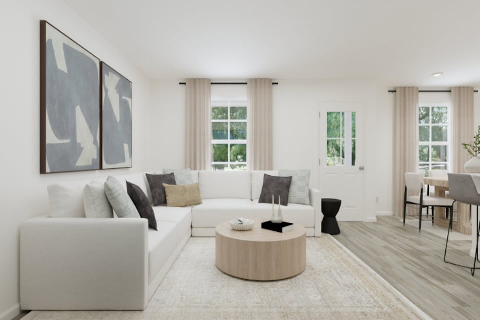 A living room with a white couch.