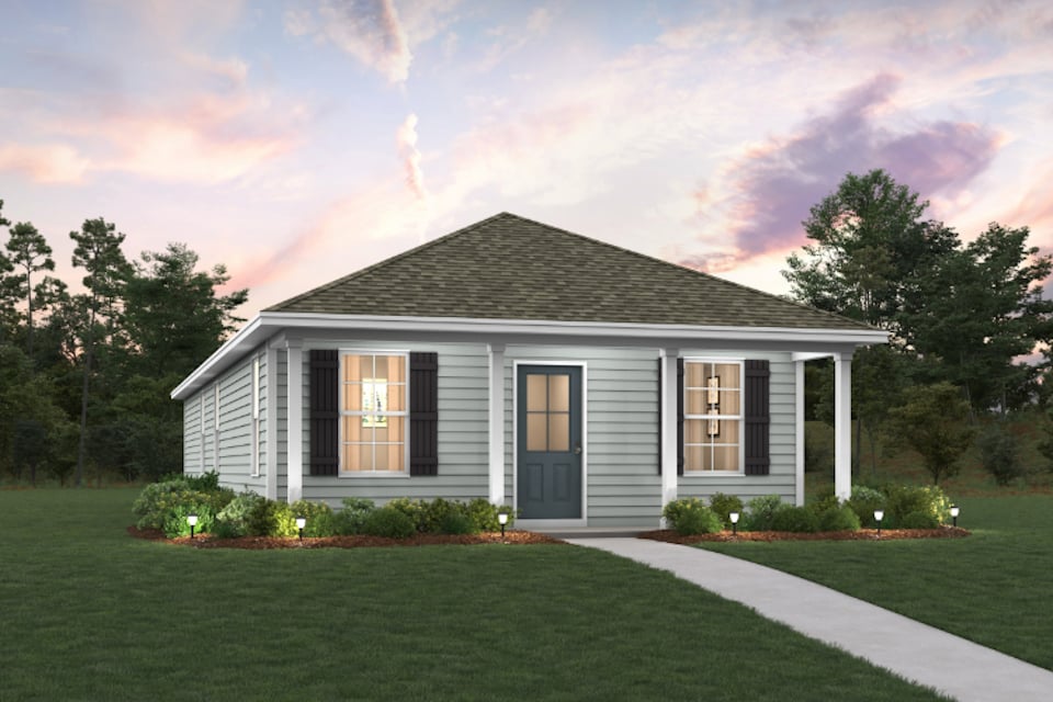 A house with a lawn and trees.