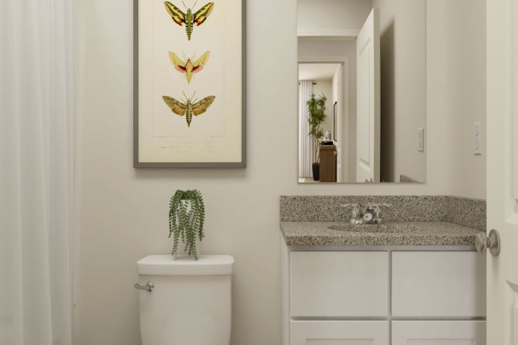 A bathroom with a marble countertop.