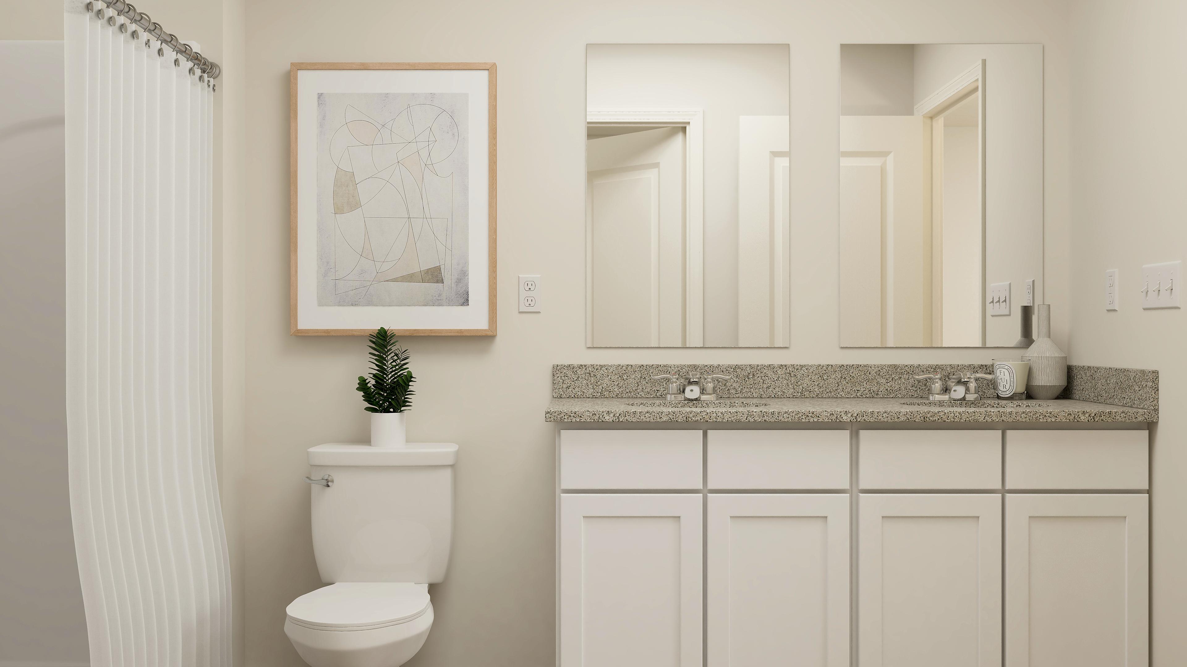 A bathroom with a marble countertop.