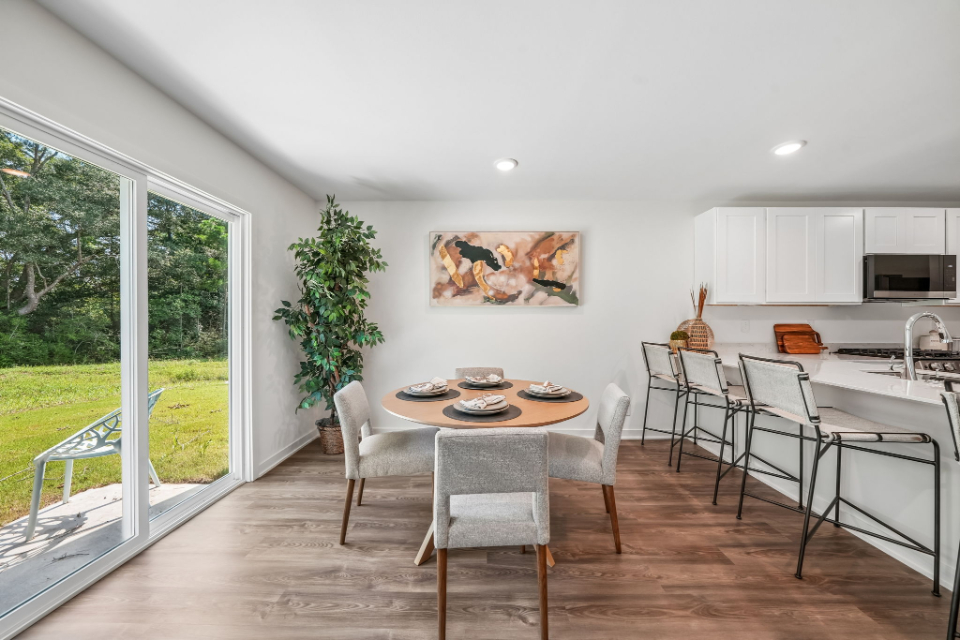 A room with a table and chairs.