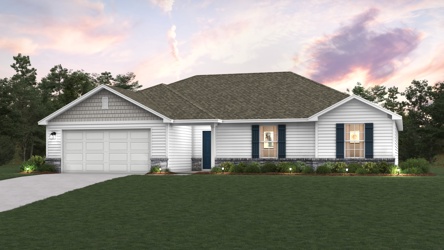 A house with a lawn in front of it.