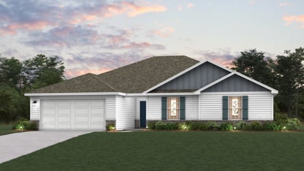 A house with a lawn in front of it.