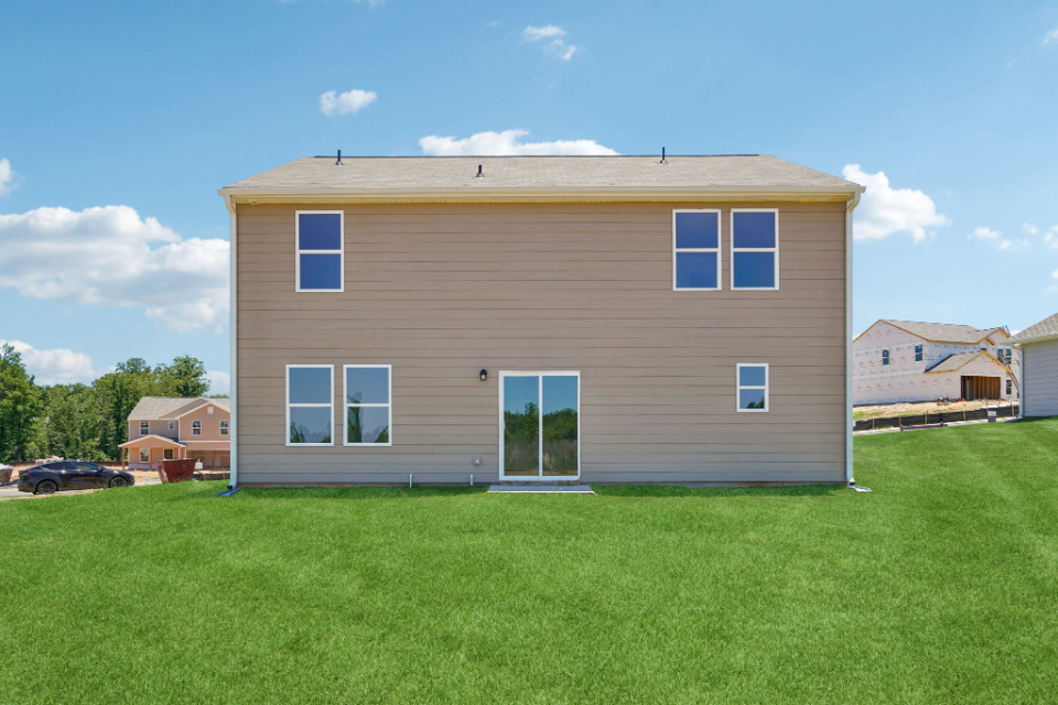 A house with a grass yard.