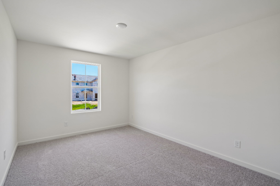 A room with a poster on the wall.