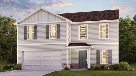 A white house with a garage.