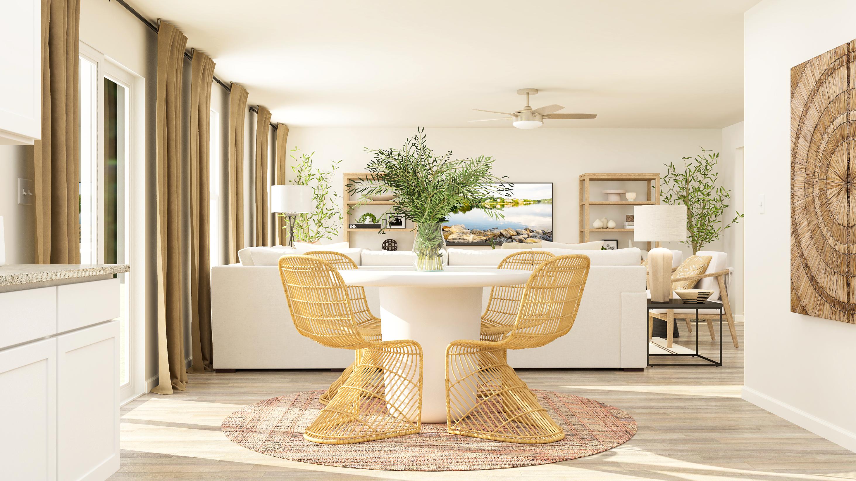 A living room with a table and chairs.