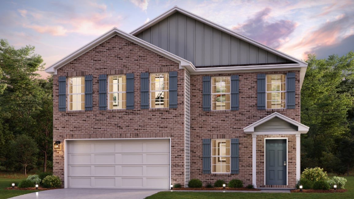 A brick house with a garage.