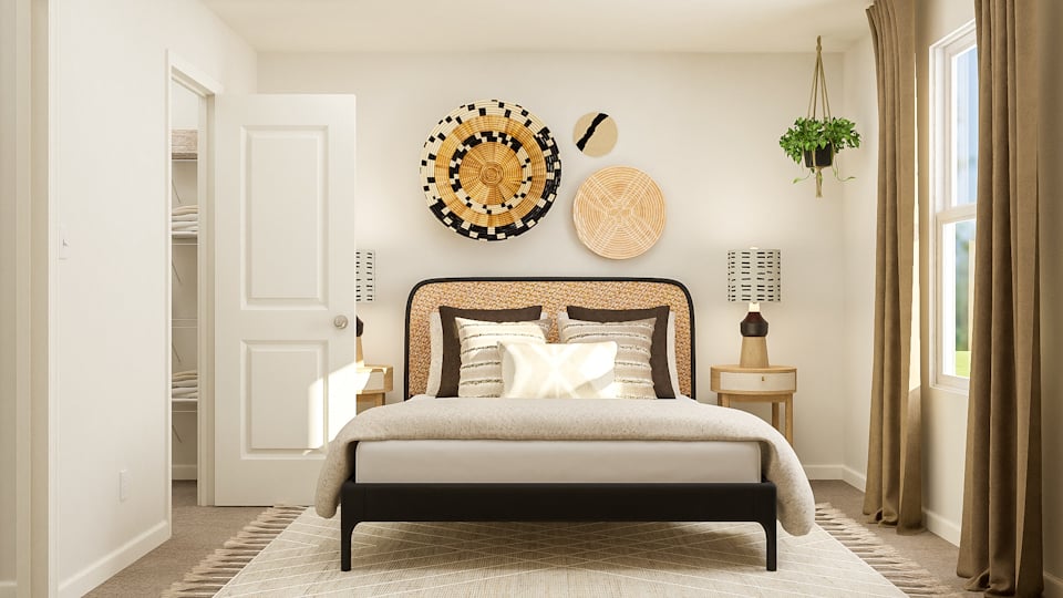 A bedroom with a bed and a lamp.