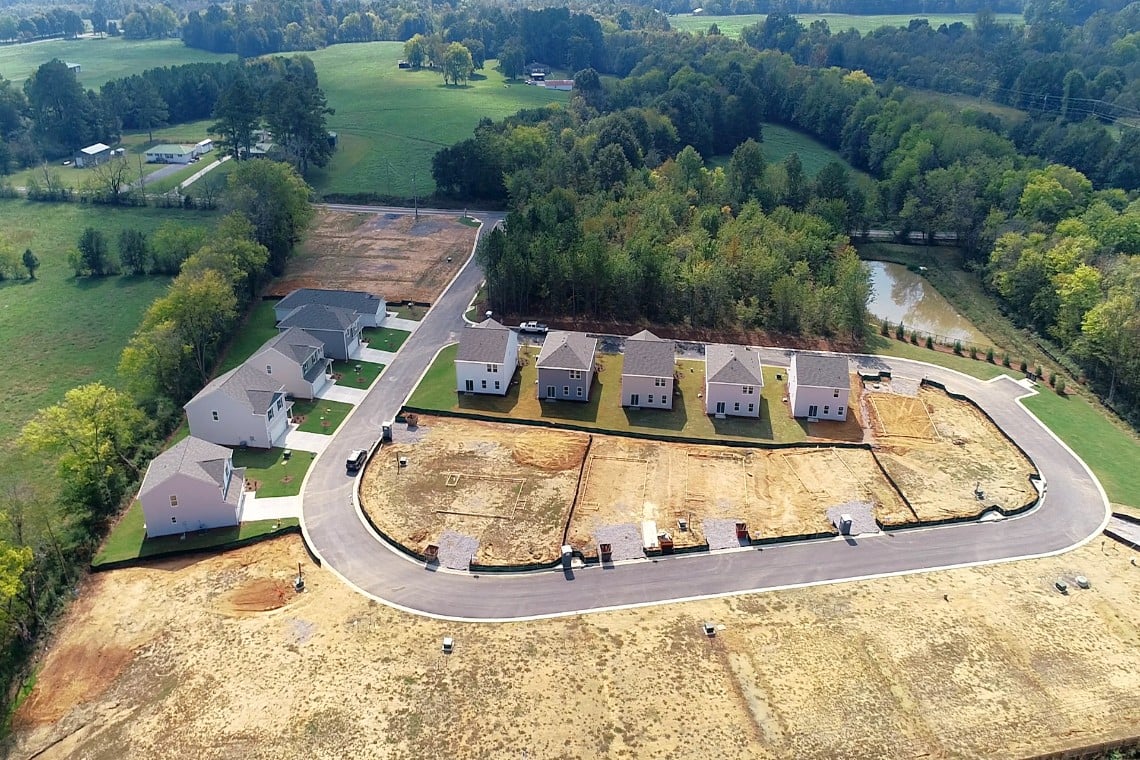 A group of buildings in a field.