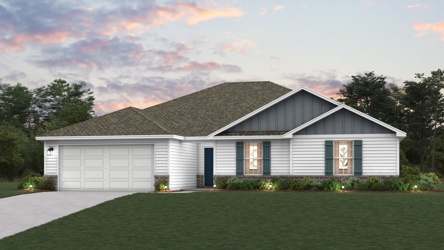 A house with a lawn in front of it.