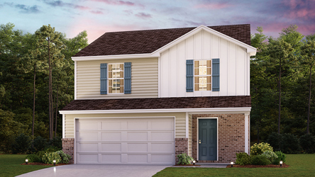 A house with a garage and trees in the back.