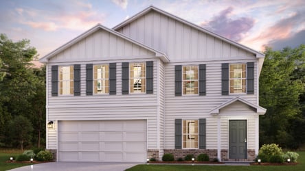 A white house with a garage.
