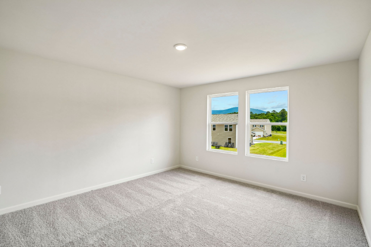 A room with a window and a door.