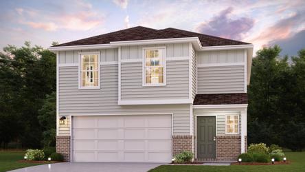 A white house with a garage.