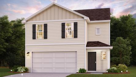 A white house with a garage.