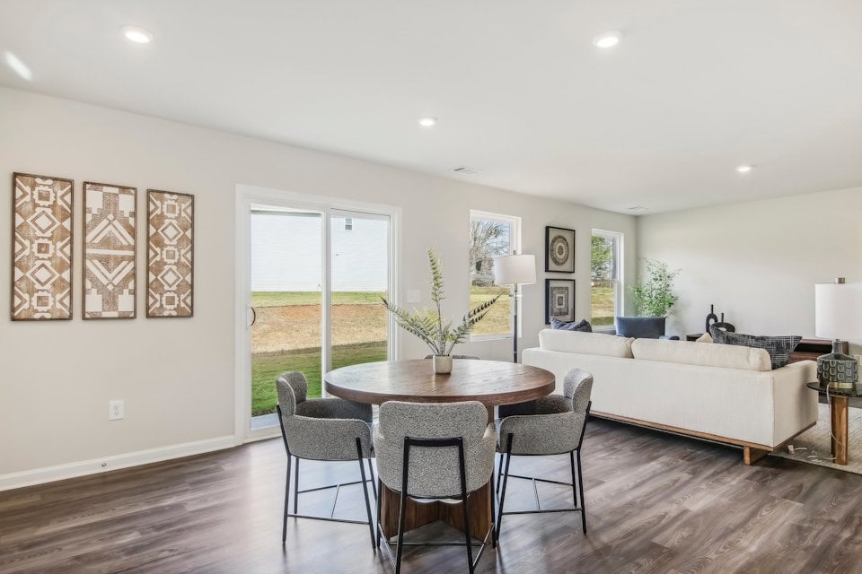 A living room with a couch and a table.