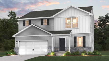 A white house with a garage.