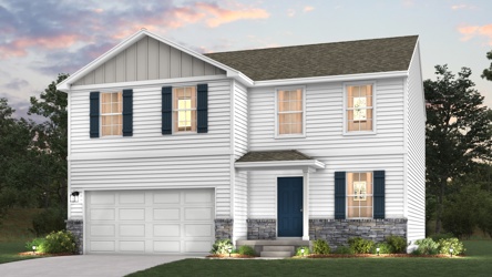 A white house with a garage.