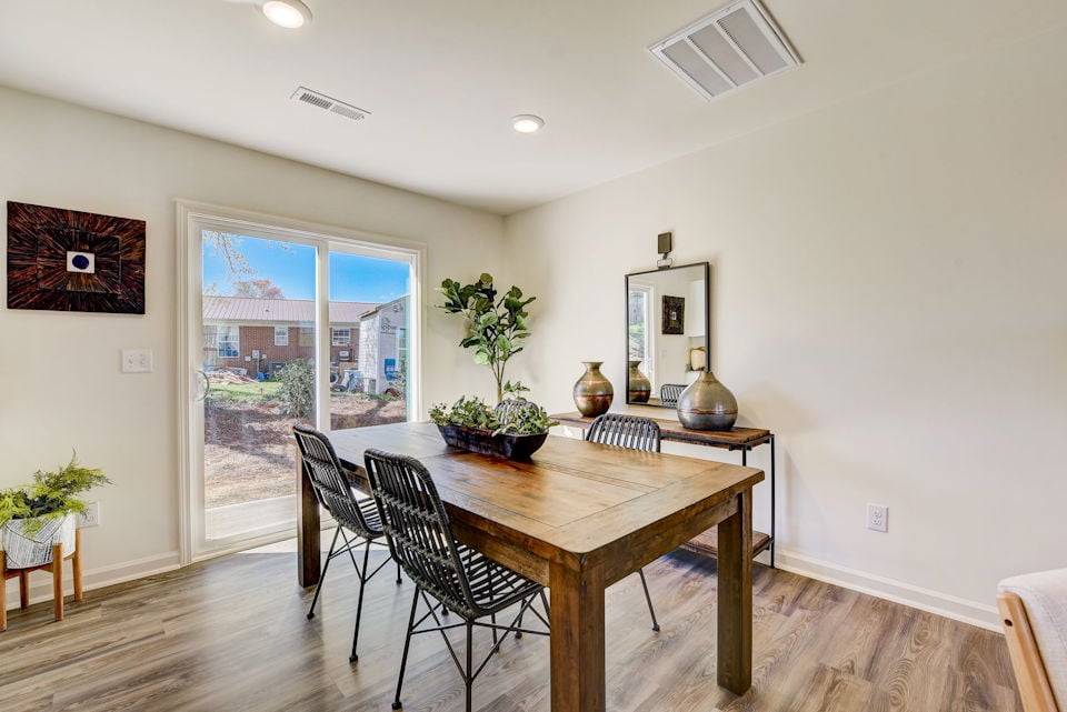 A dining room table with chairs.