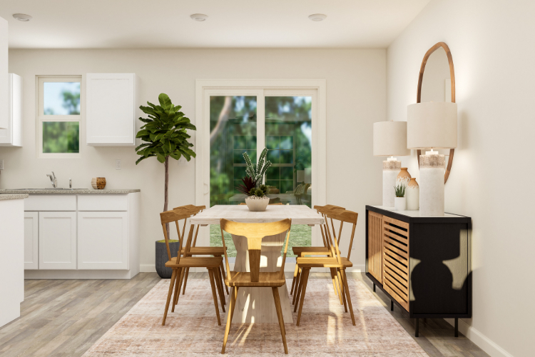 A kitchen with a dining table and chairs.