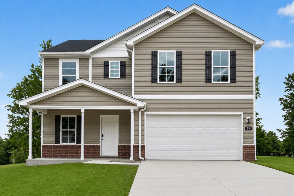 A white house with a garage.