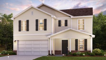 A white house with a driveway.