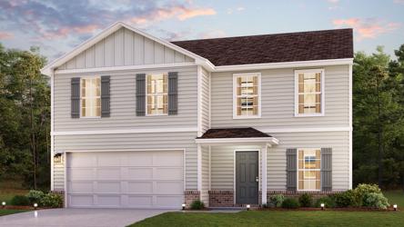 A white house with a garage.