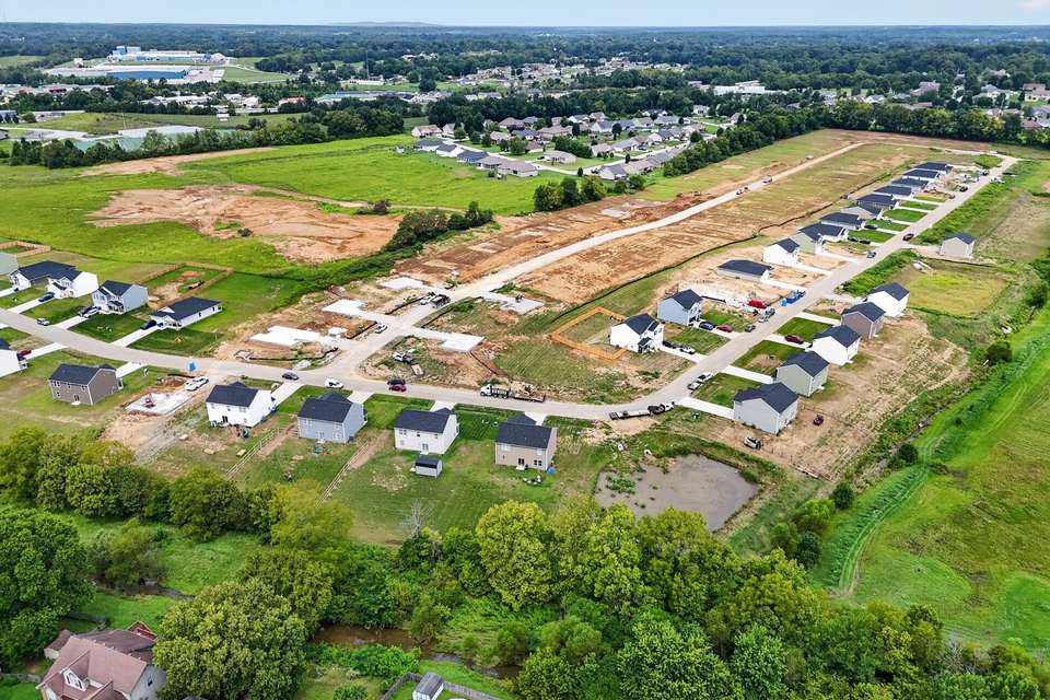 A group of houses in a field.