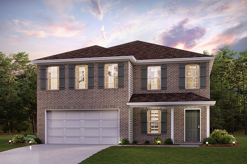 A house with a garage with Greersburg Academy in the background.