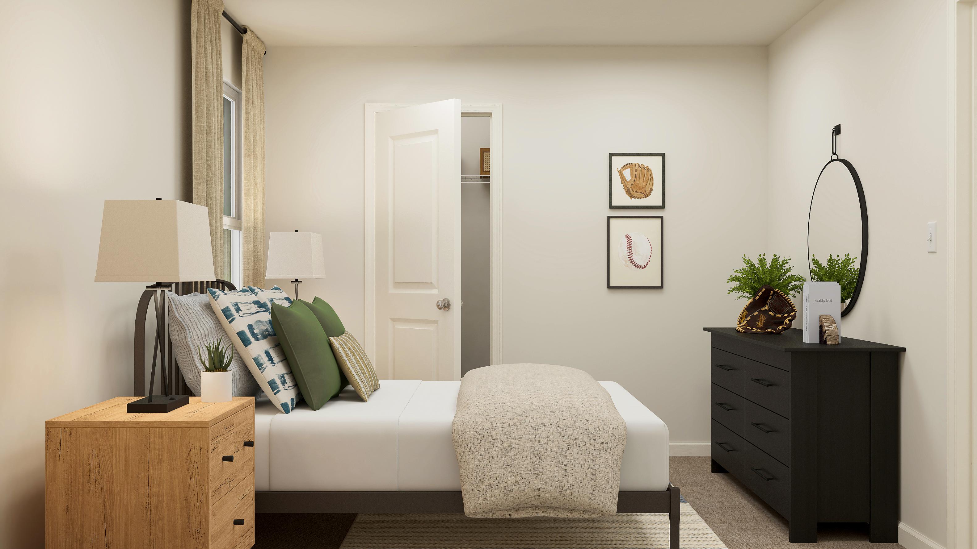 A living room with a white couch and a white chair.