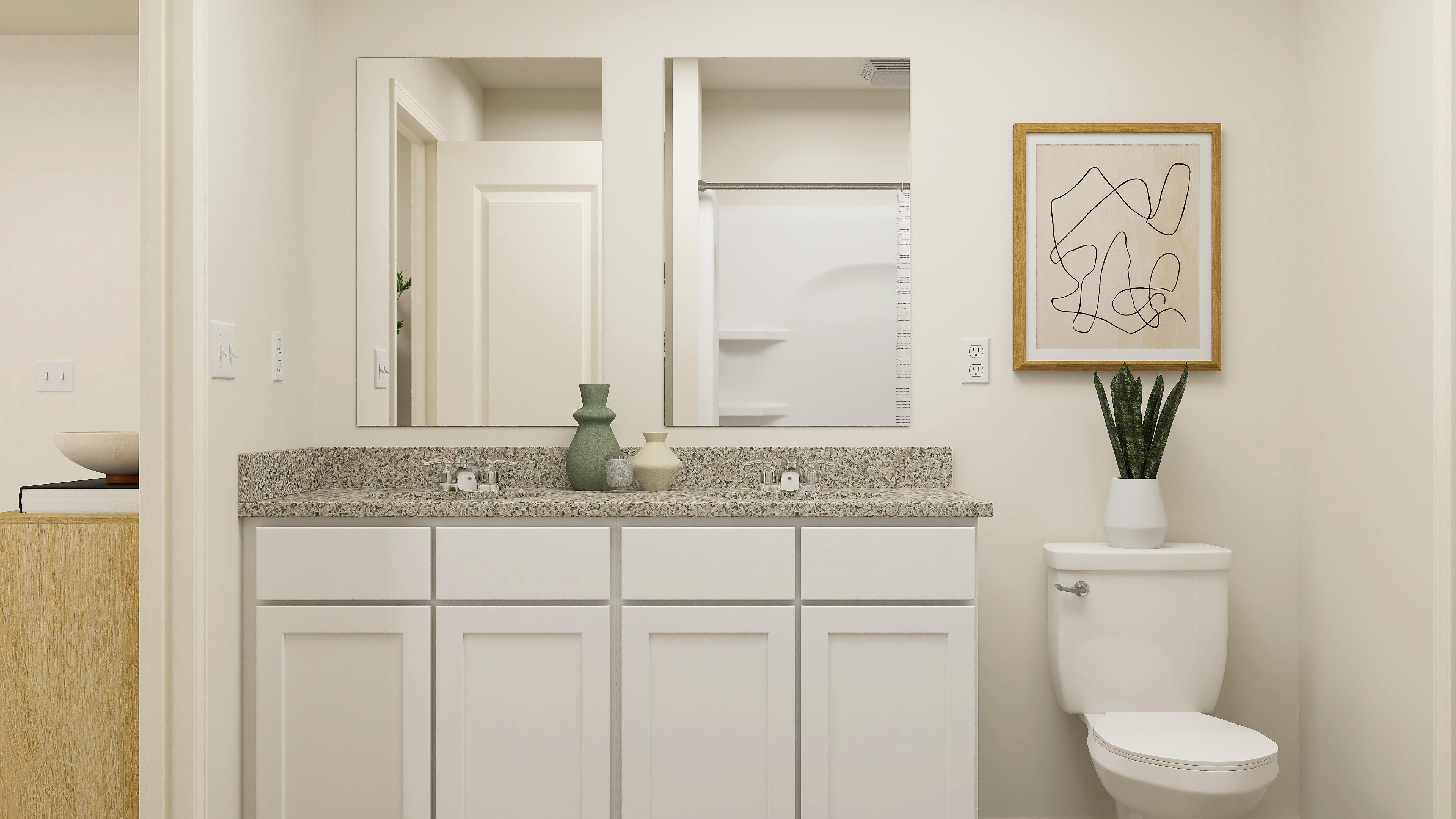 A bathroom with a marble countertop.