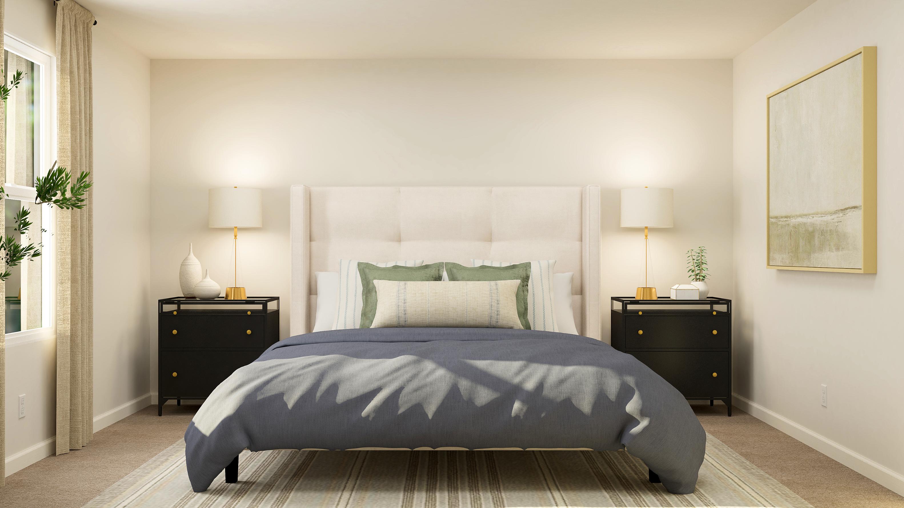 A bedroom with a bed and lamps.