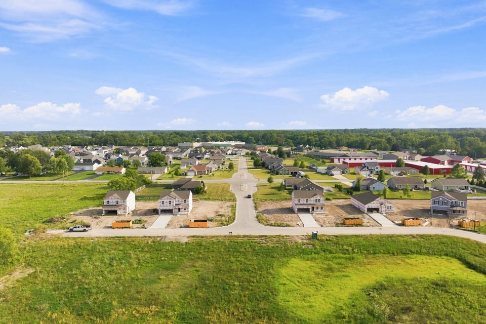 A group of houses in a field.