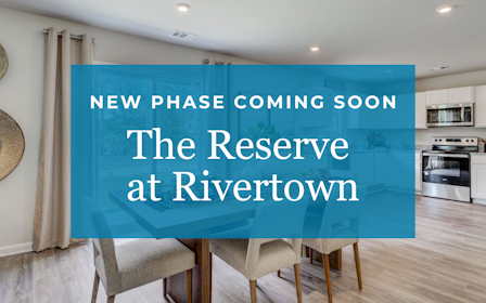 A room with a blue wall and chairs.