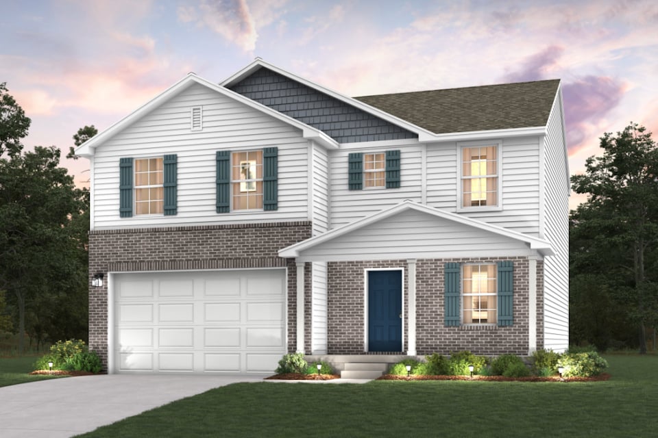 A white house with a garage.