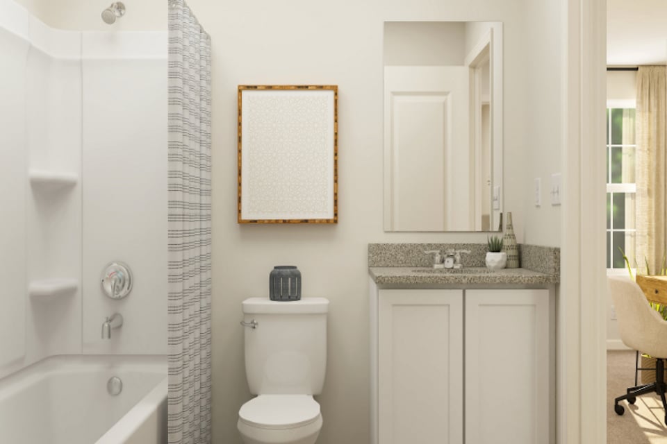 A bathroom with a sink toilet and bathtub.
