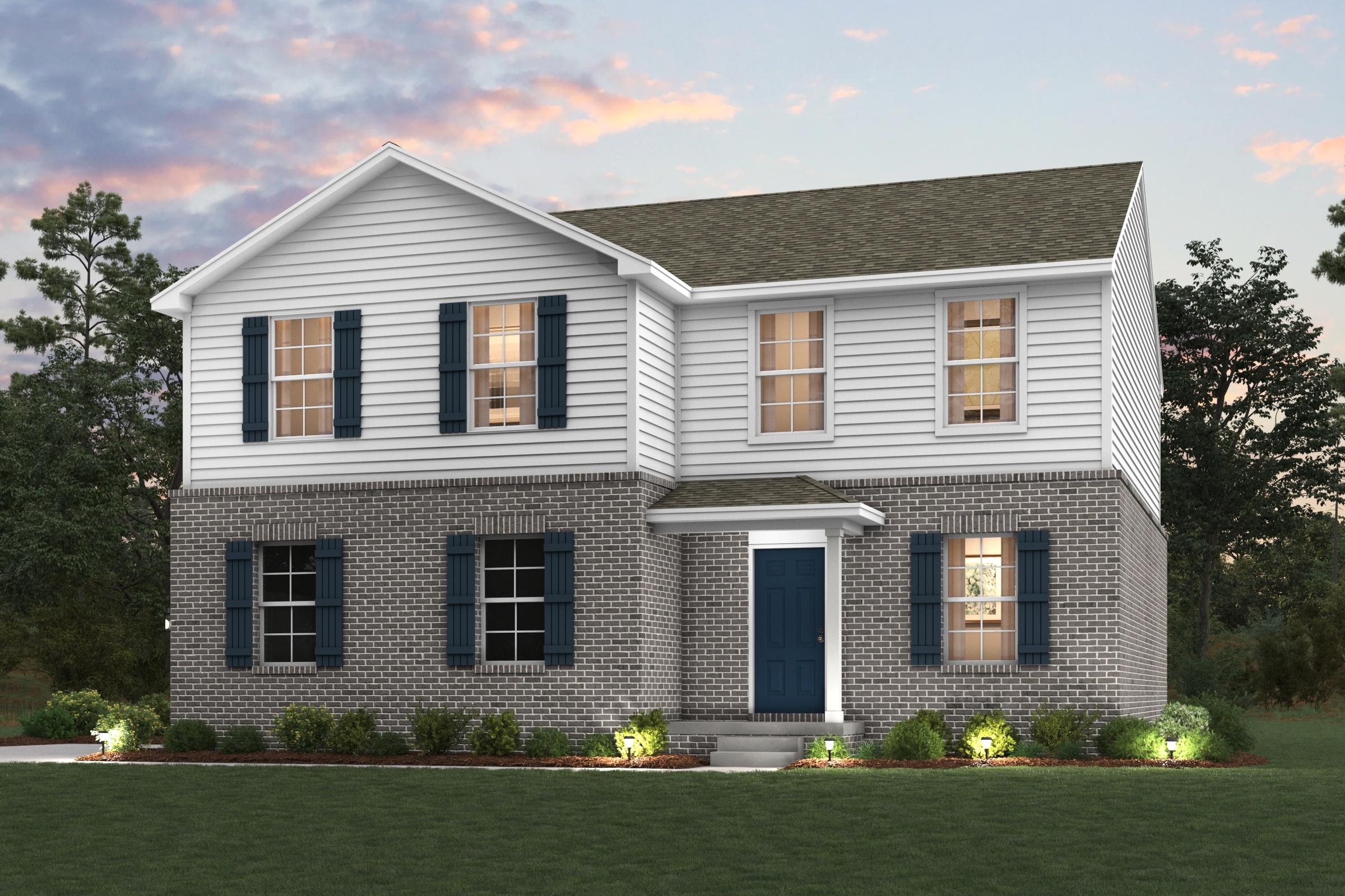 A house with a lawn in front of it.