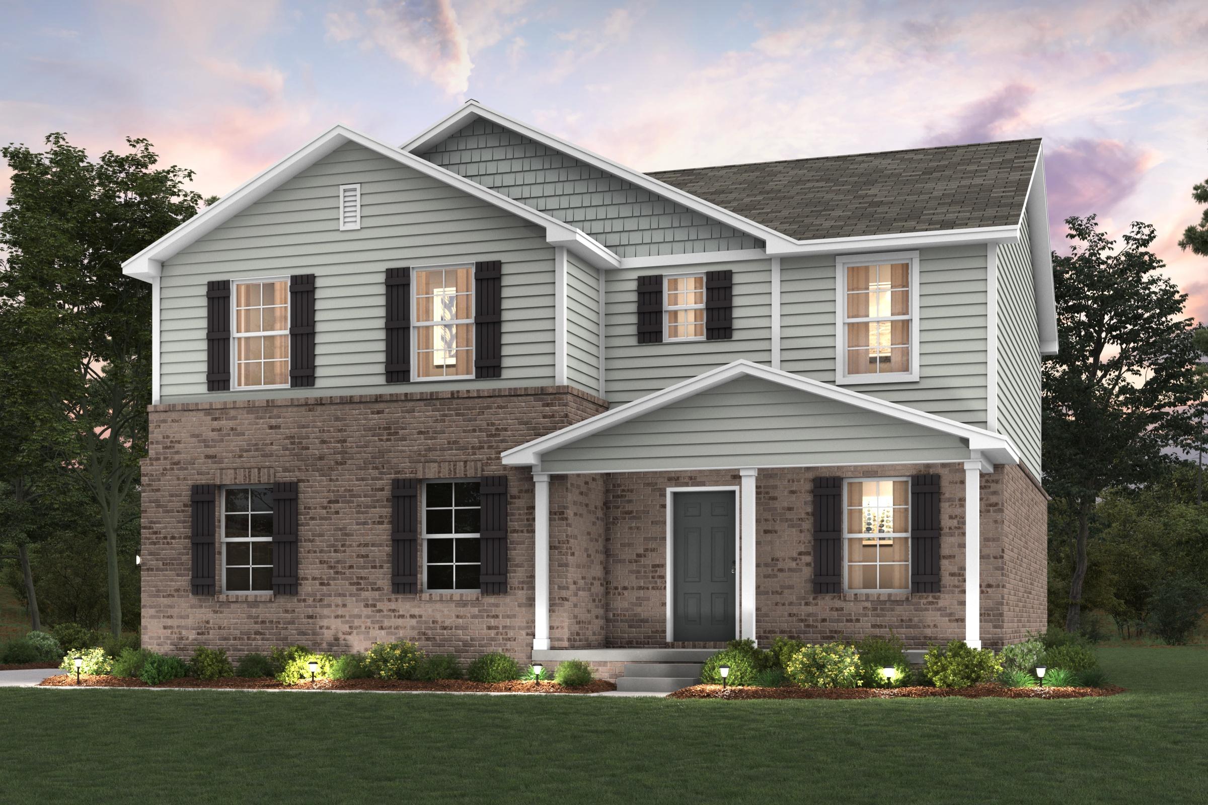 A large house with a lawn in front of it.