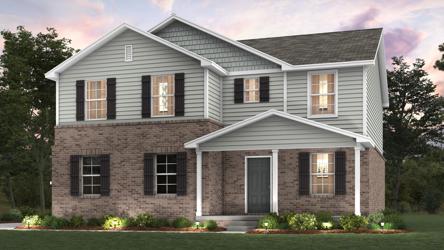 A large house with a lawn in front of it.