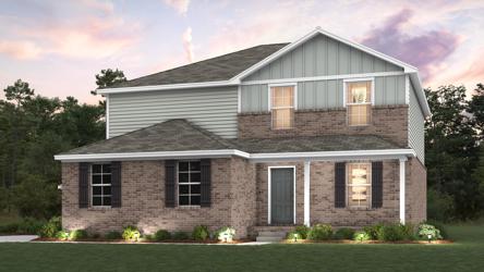 A house with a lawn in front of it.