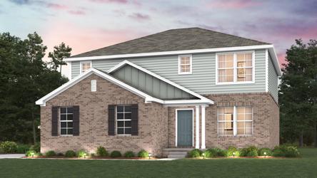 A house with a lawn in front.