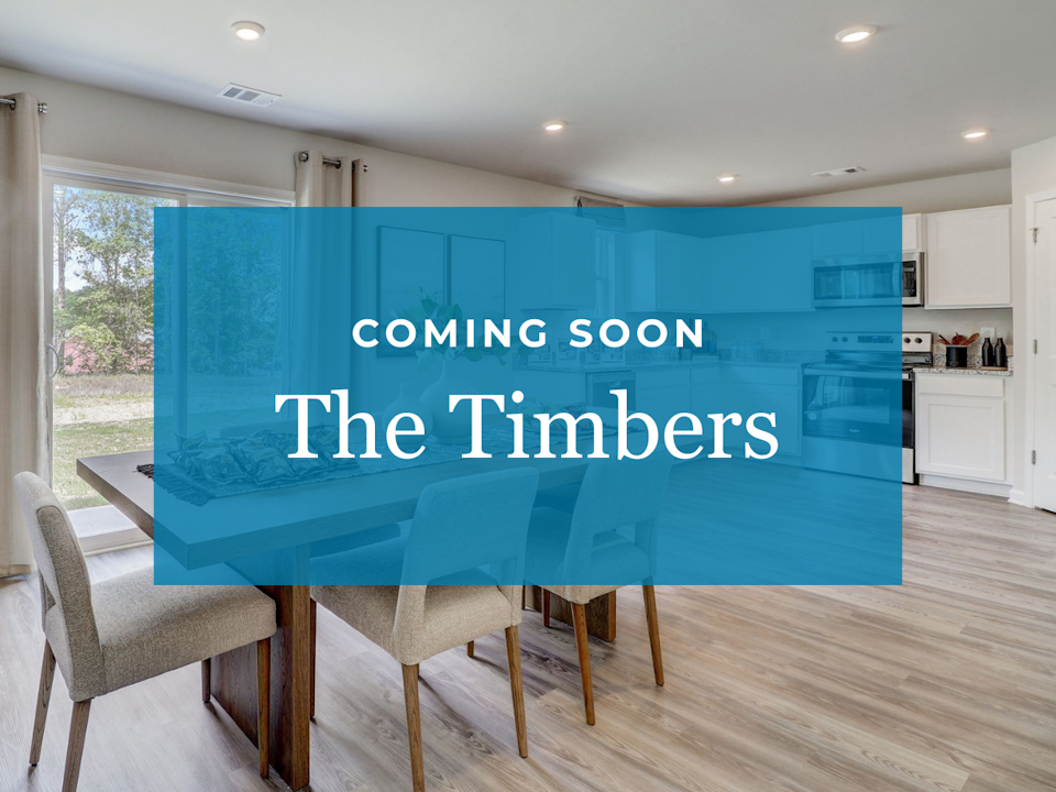 A room with a table and chairs.