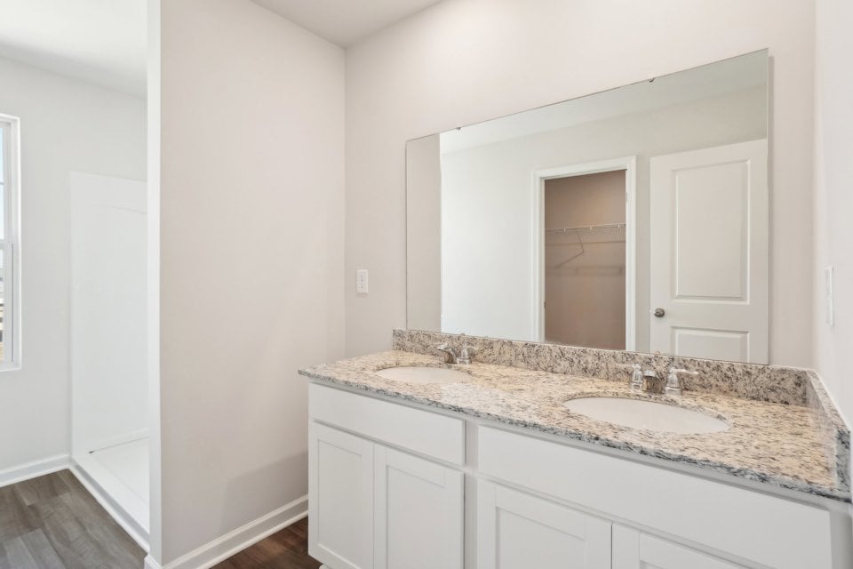A bathroom with a marble countertop.