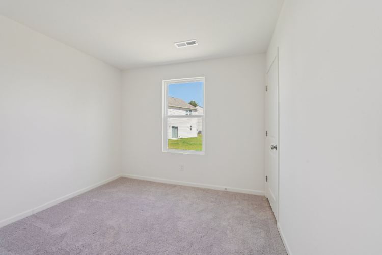 A hallway with a window.