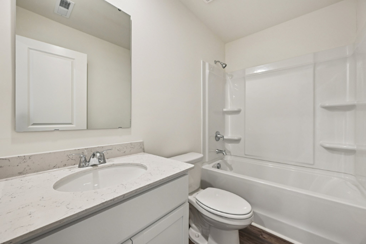 A bathroom with a sink and a toilet.