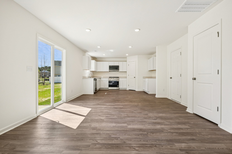 A large kitchen with white cabinets.