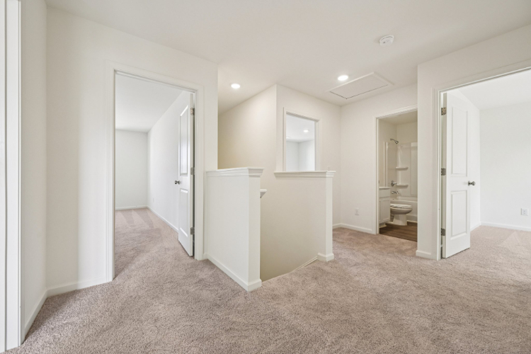 A bathroom with white walls.